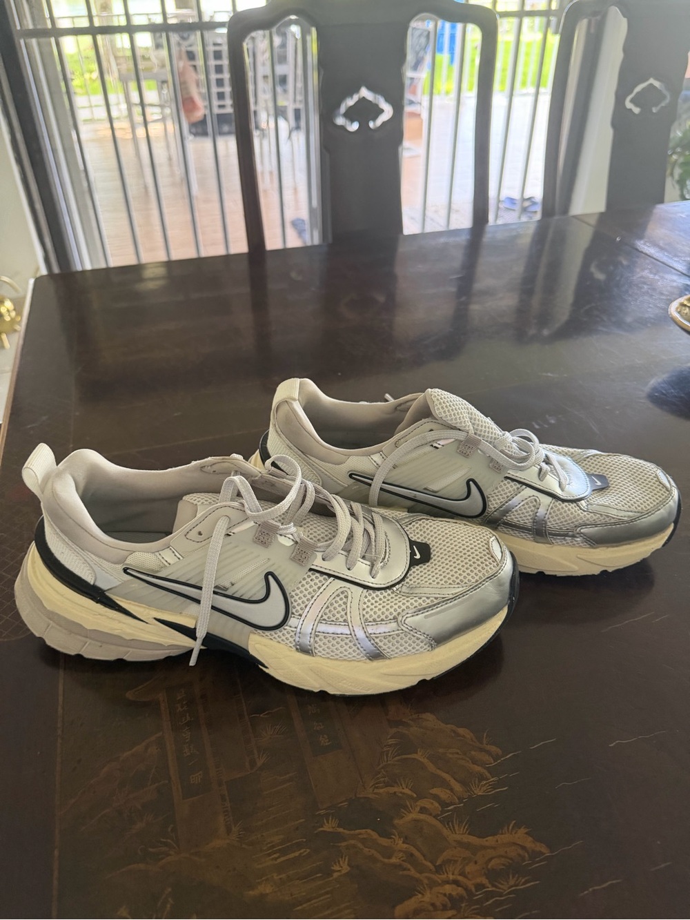 Nike V2K Run sneakers in the Summit White and Metallic Silver colorway